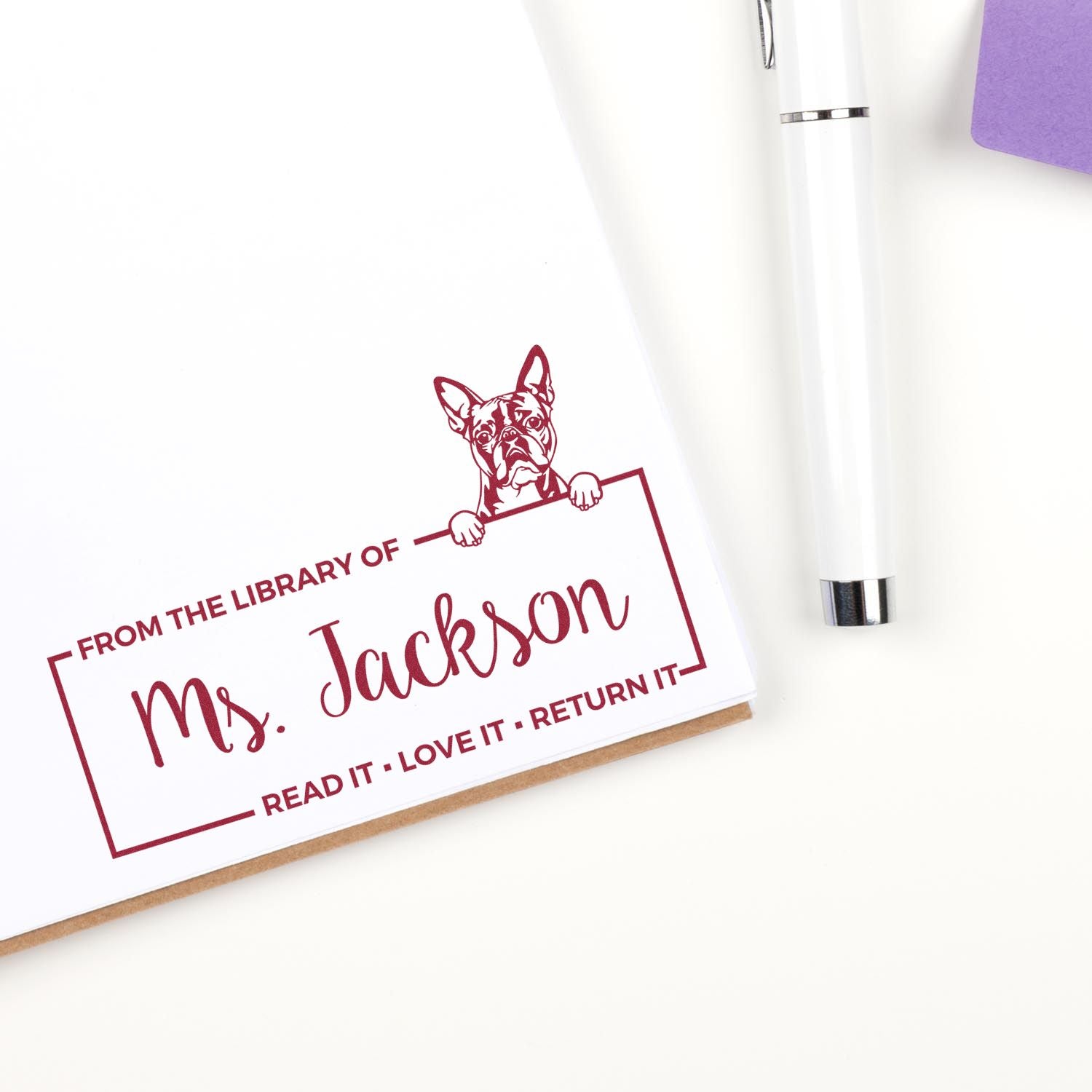 Custom rubber stamp for books, featuring a dog and personalized From the Library of Ms. Jackson return-it bookplate design.