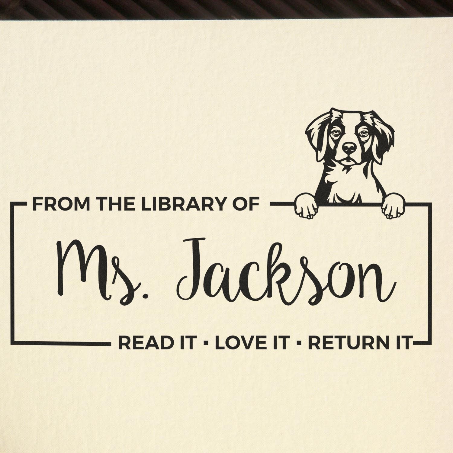 Custom dog library rubber stamp reading From the library of Ms. Jackson  Read it, love it, return it.