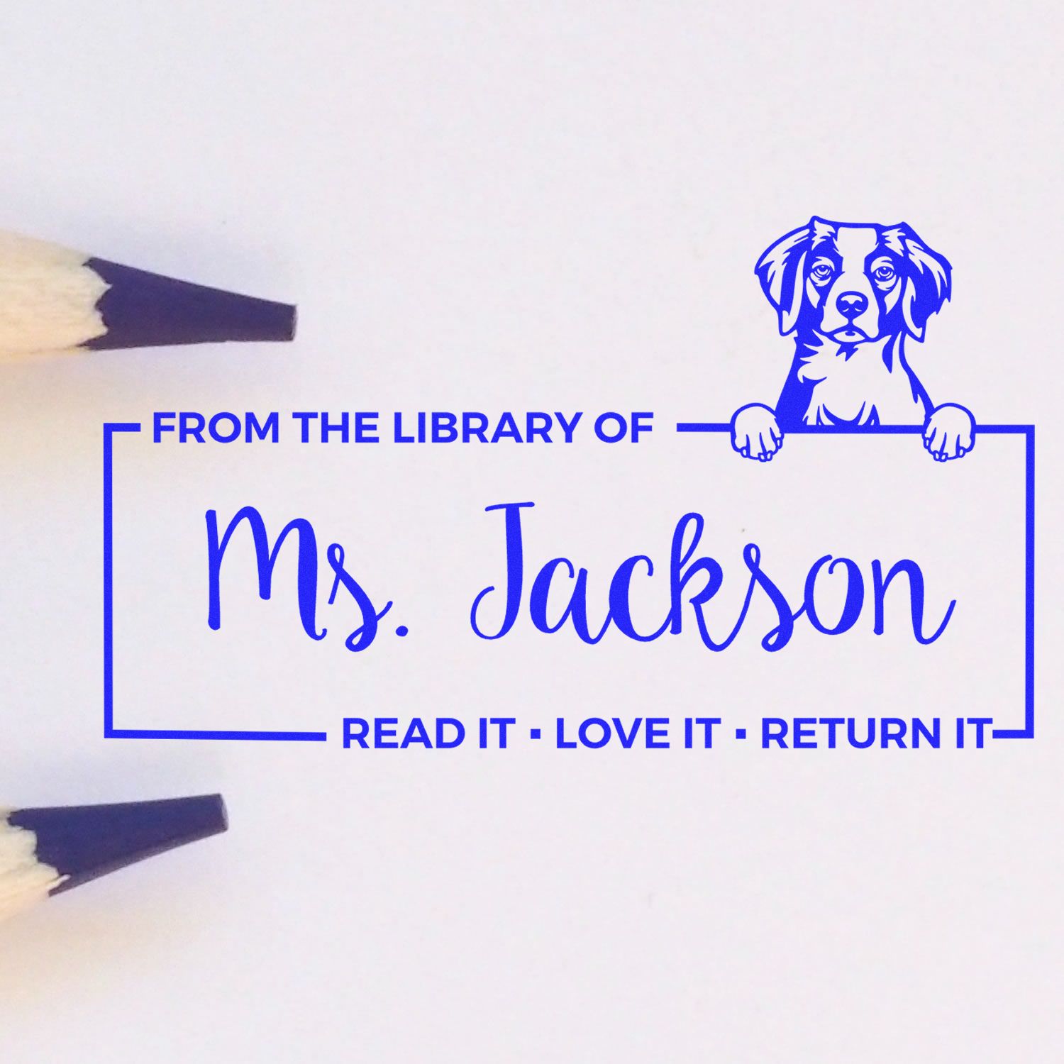 Personalized rubber stamp for Ms. Jackson's library books, with dog illustration and "Read It, Love It, Return It" message.