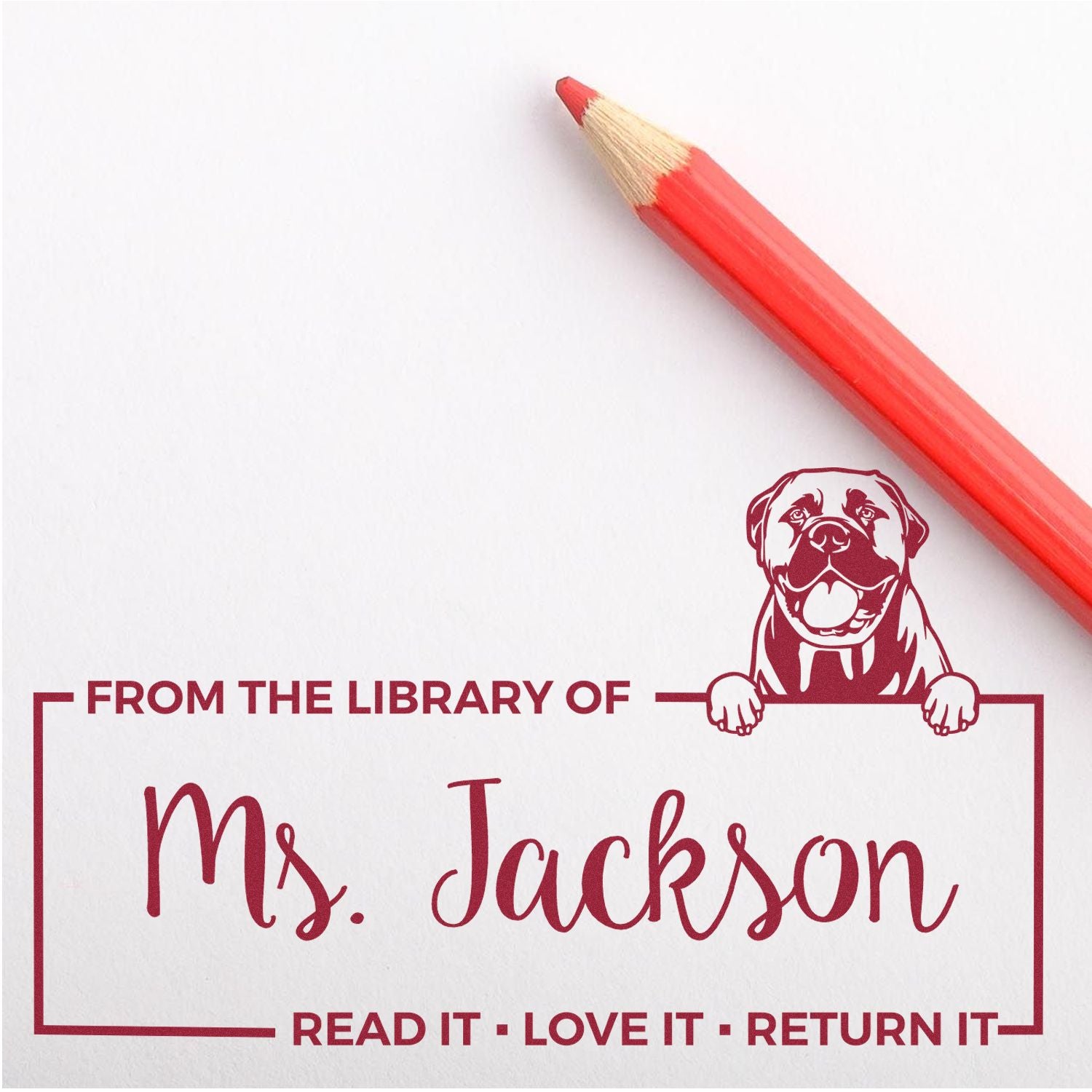 Custom library rubber stamp for Ms. Jackson with dog design and Read It, Love It, Return It message for book lending.