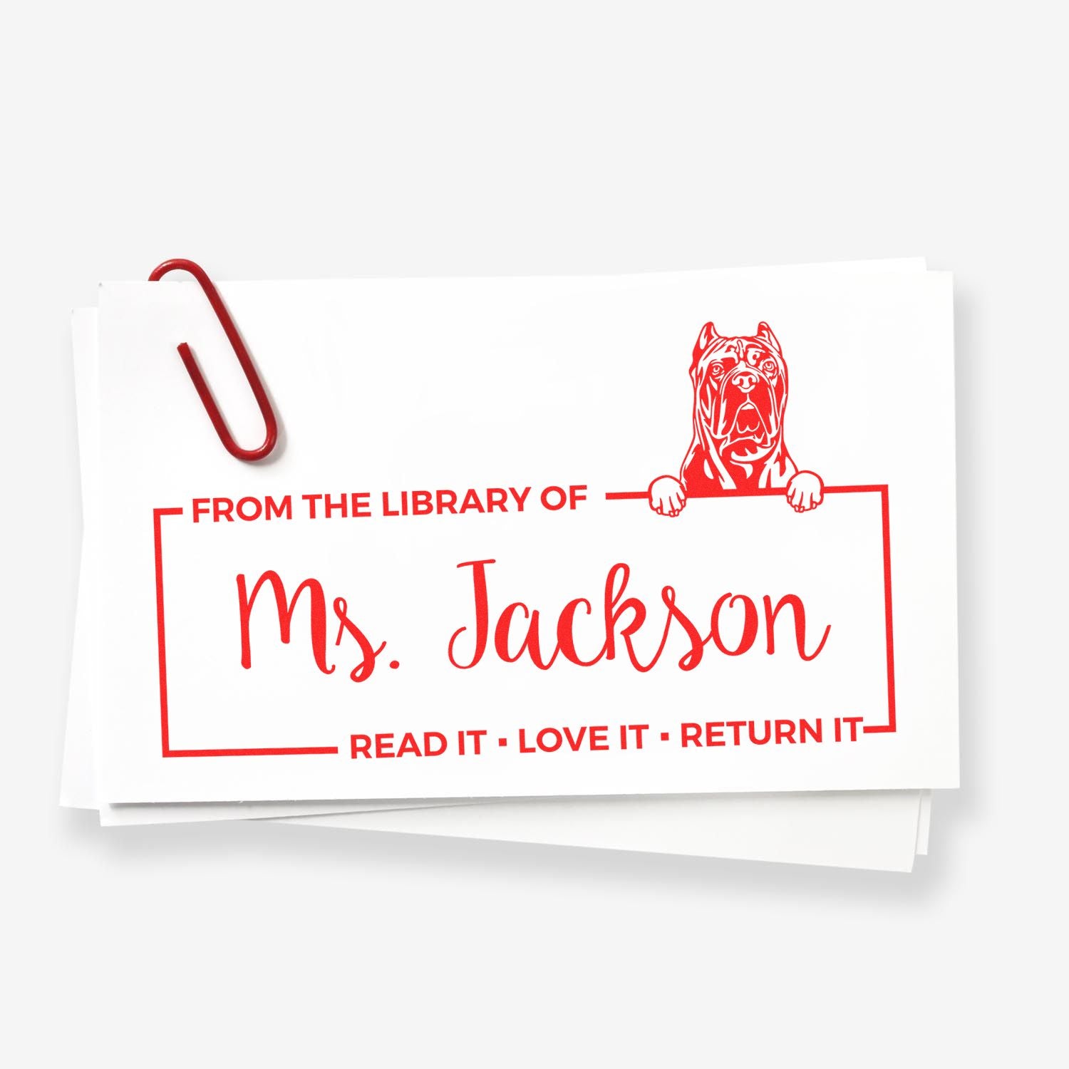 Custom library rubber stamp for Ms. Jackson with dog design and Read it, love it, return it bookplate text.