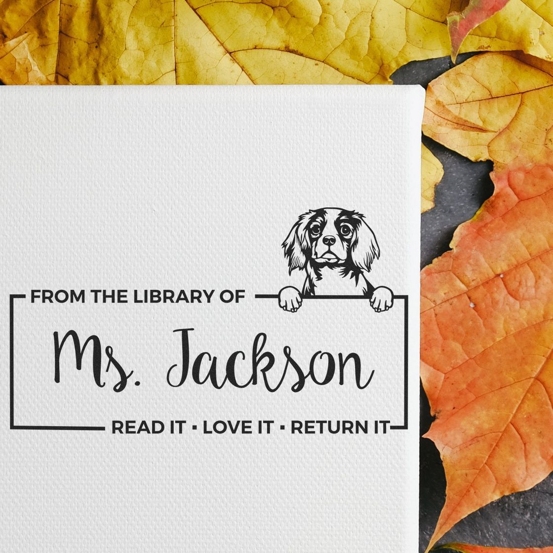 Personalized library rubber stamp with dog illustration and From the Library of Ms. Jackson read it, love it, return it design.