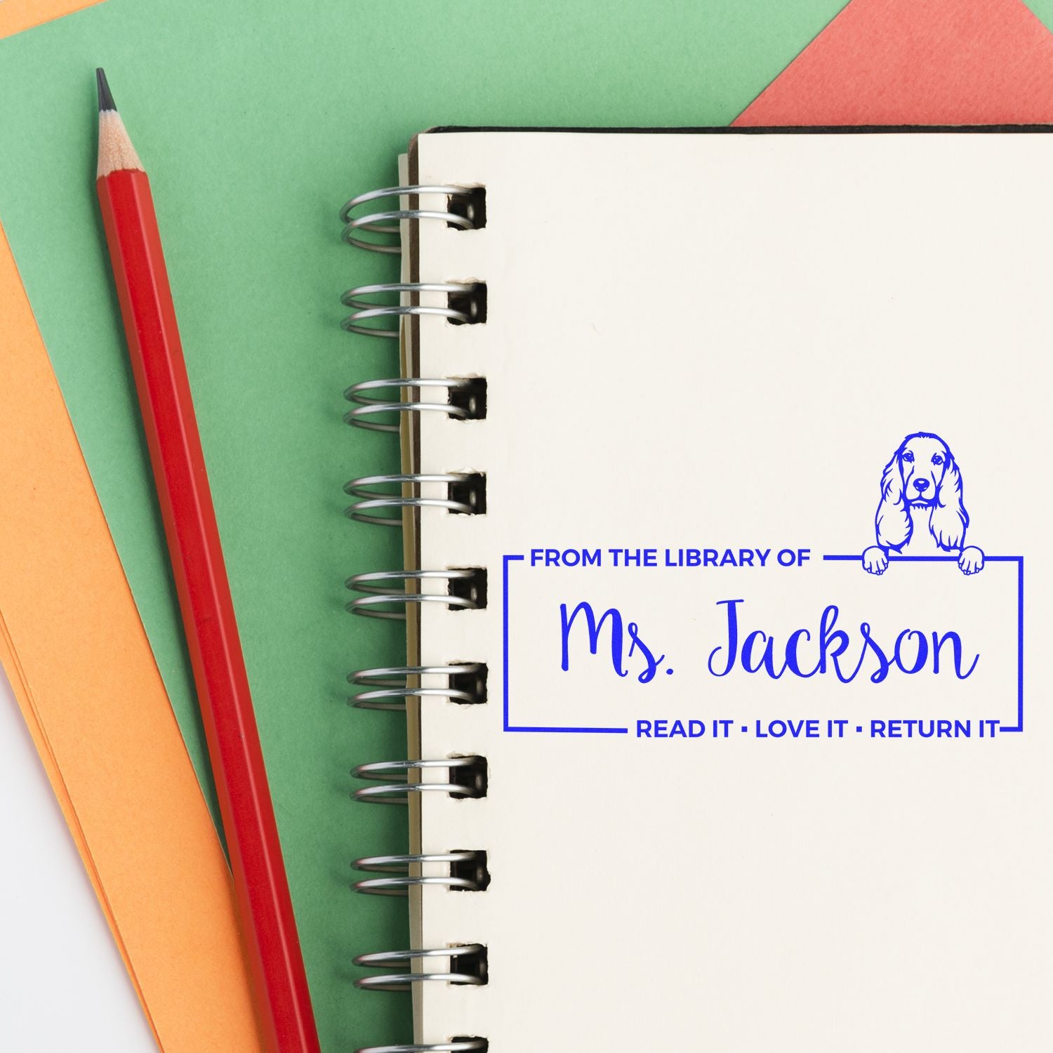 Custom library rubber stamp for Ms. Jackson with dog design, ideal for marking books and classroom lending.