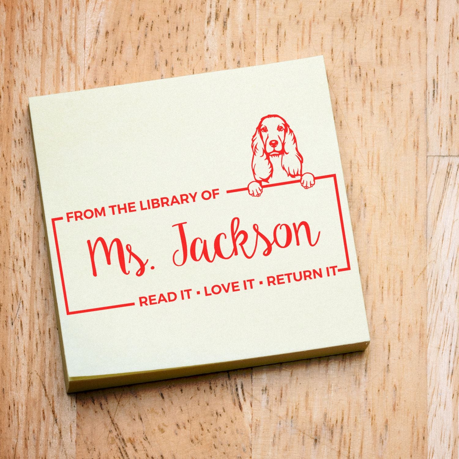 Personalized library rubber stamp for books with dog illustration and Read it, love it, return it for Ms. Jackson.