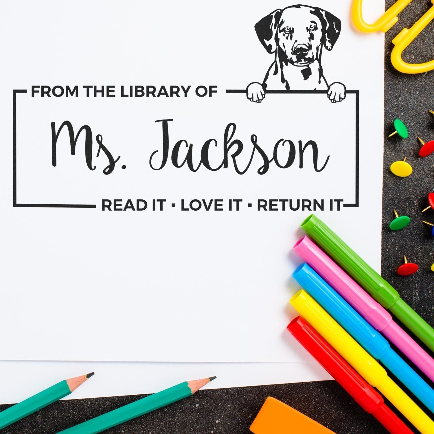 Personalized rubber library stamp for Ms. Jackson with dog illustration and Read it, Love it, Return it book label.