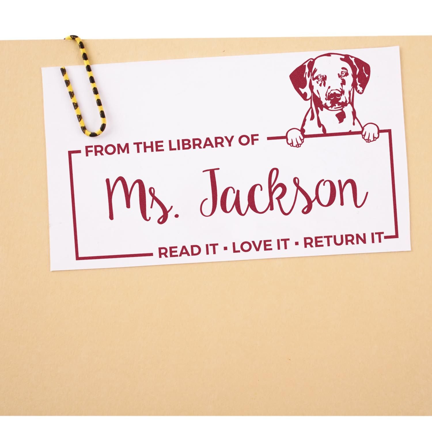 Custom rubber stamp bookplate reading From the Library of Ms. Jackson with dog illustration and Read it, Love it, Return it.