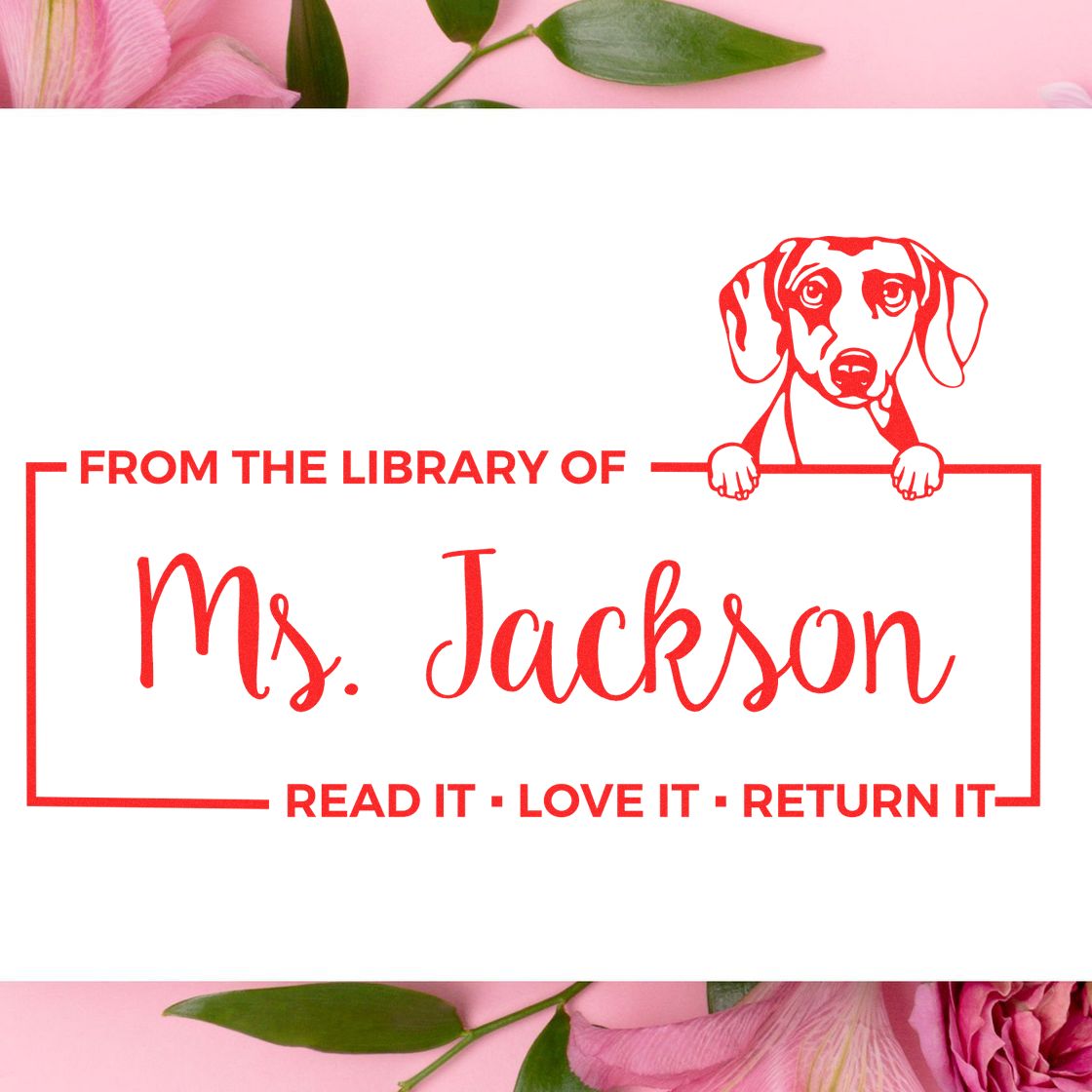 Personalized library rubber stamp for Ms. Jackson with dog art and Read it, love it, return it bookplate text.