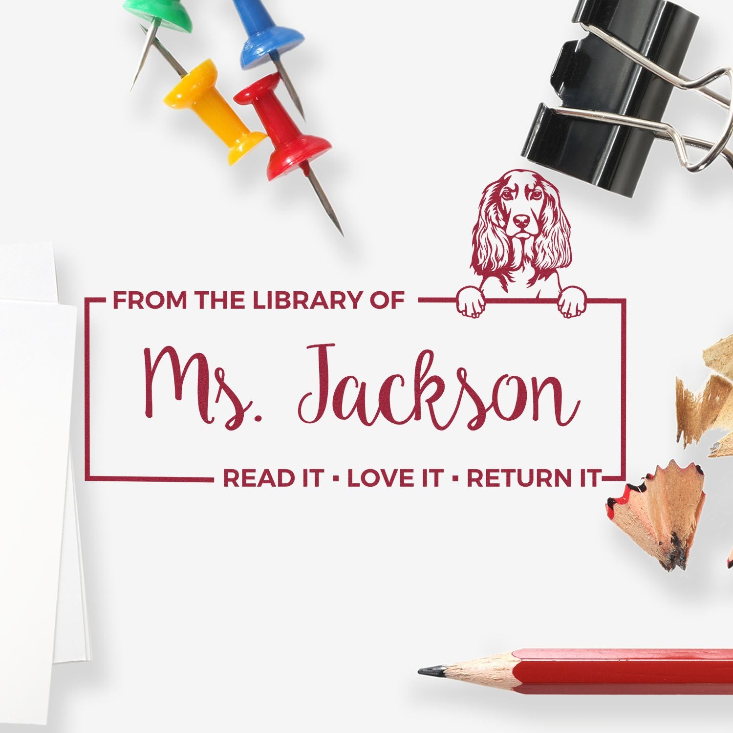 Custom library rubber stamp for books reading From the Library of Ms. Jackson with dog design and return reminder.