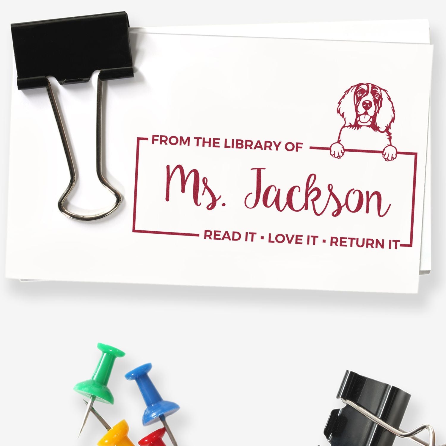 Custom library book rubber stamp with dog design and personalized From the Library of Ms. Jackson read, love, return message.