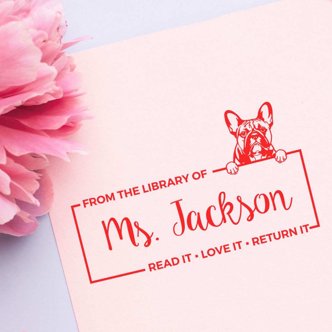 Custom library rubber stamp with French bulldog design and Read it, love it, return it message for Ms. Jacksons books.