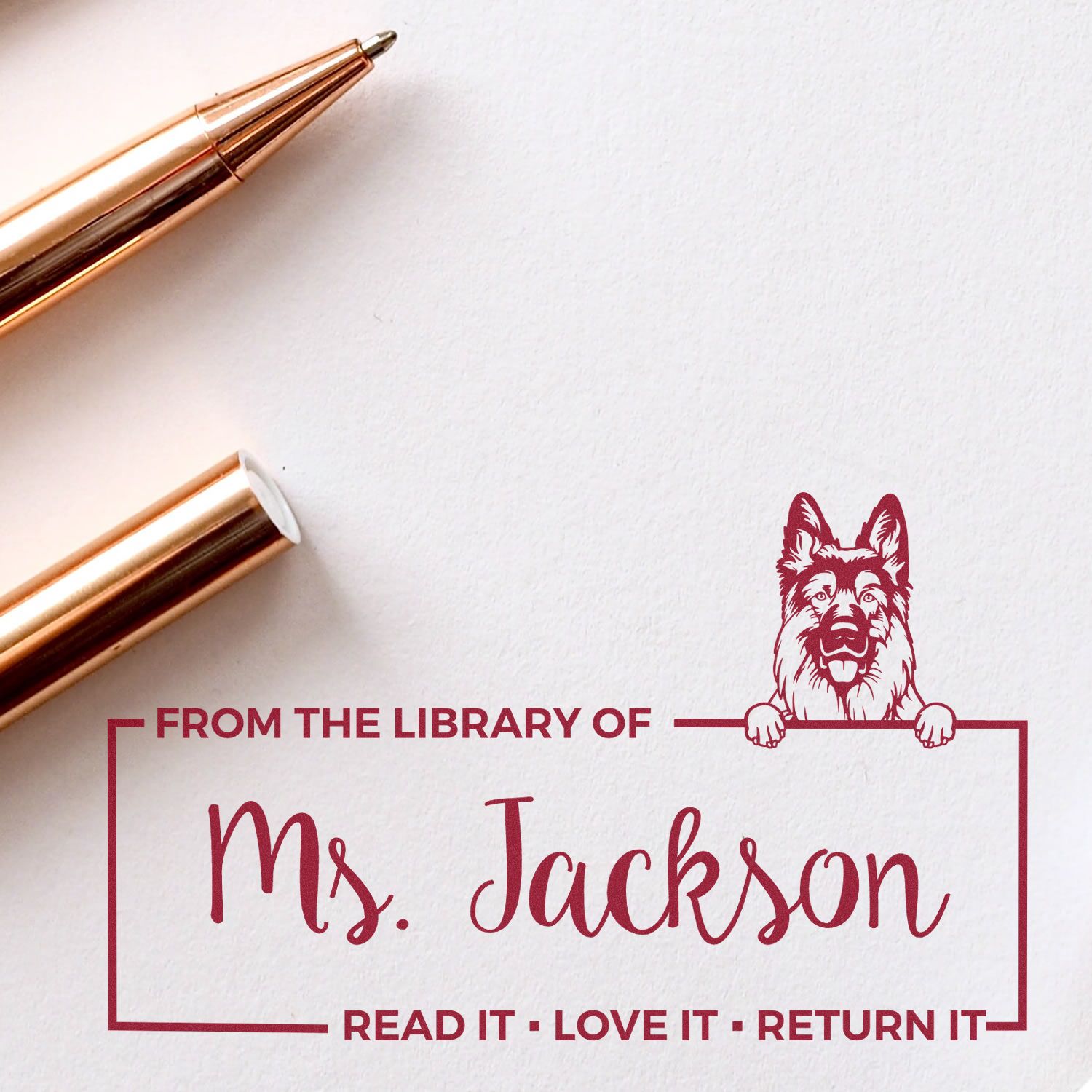 Personalized library rubber stamp for books with Ms. Jackson name, dog graphic, and Read It. Love It. Return It.