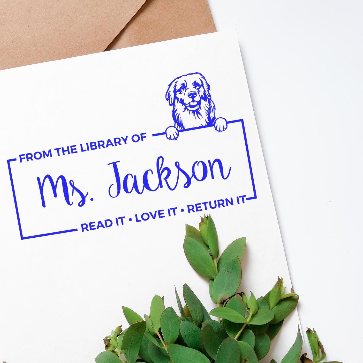 Custom rubber stamp book return for Ms. Jackson, with dog illustration and Read it, love it, return it library message.