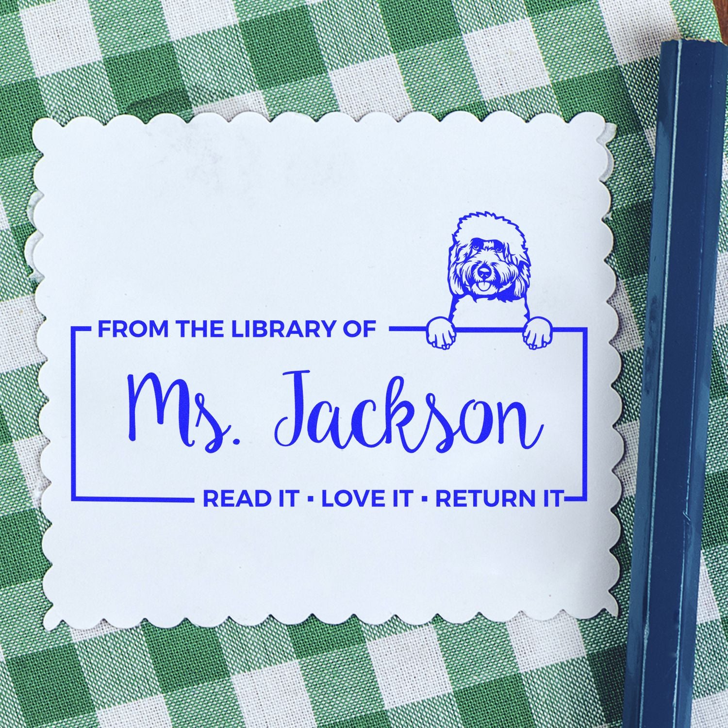 Personalized rubber stamp bookplate for Mrs. Jackson, featuring dog logo and Read It, Love It, Return It library ownership text.