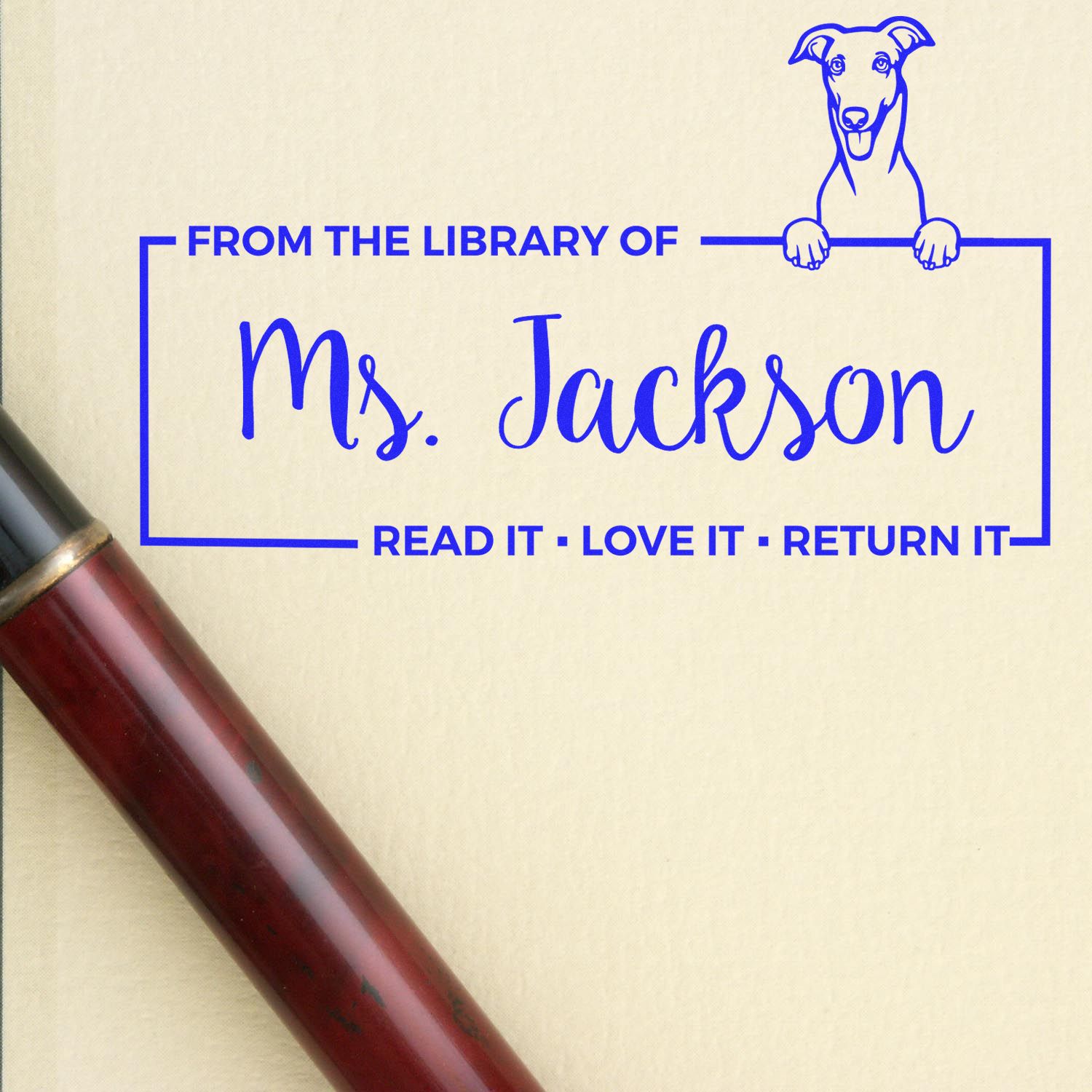 Personalized rubber library book stamp for Ms. Jackson with dog design and Read it, Love it, Return it message