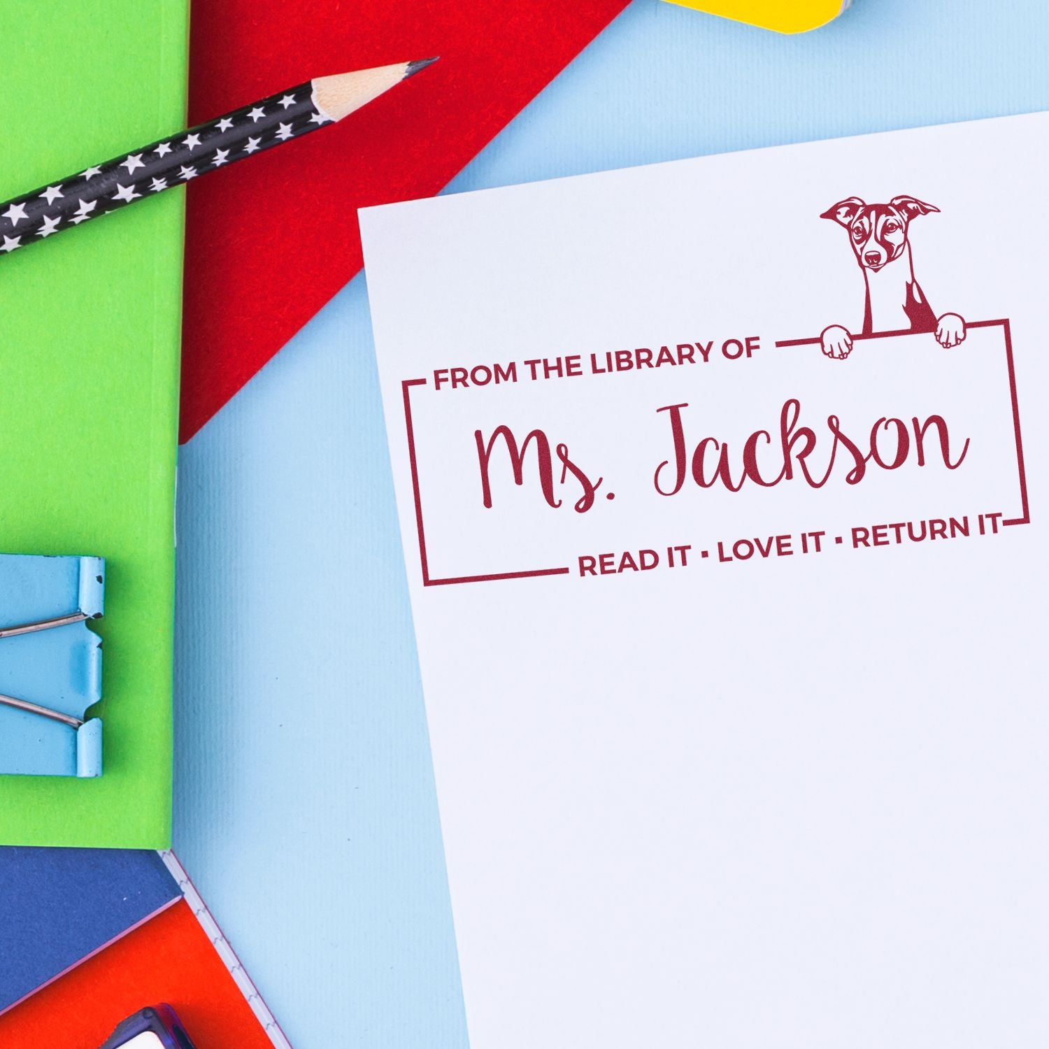 Custom rubber library book stamp for Ms. Jackson with dog design and Read it, Love it, Return it message.