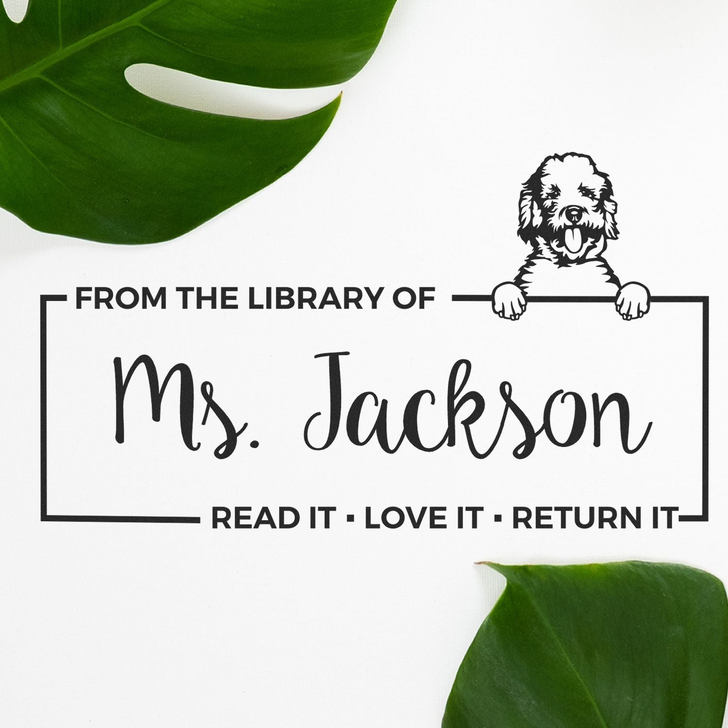 Custom library rubber stamp for Ms. Jackson with dog design and Read it, love it, return it book ownership text.
