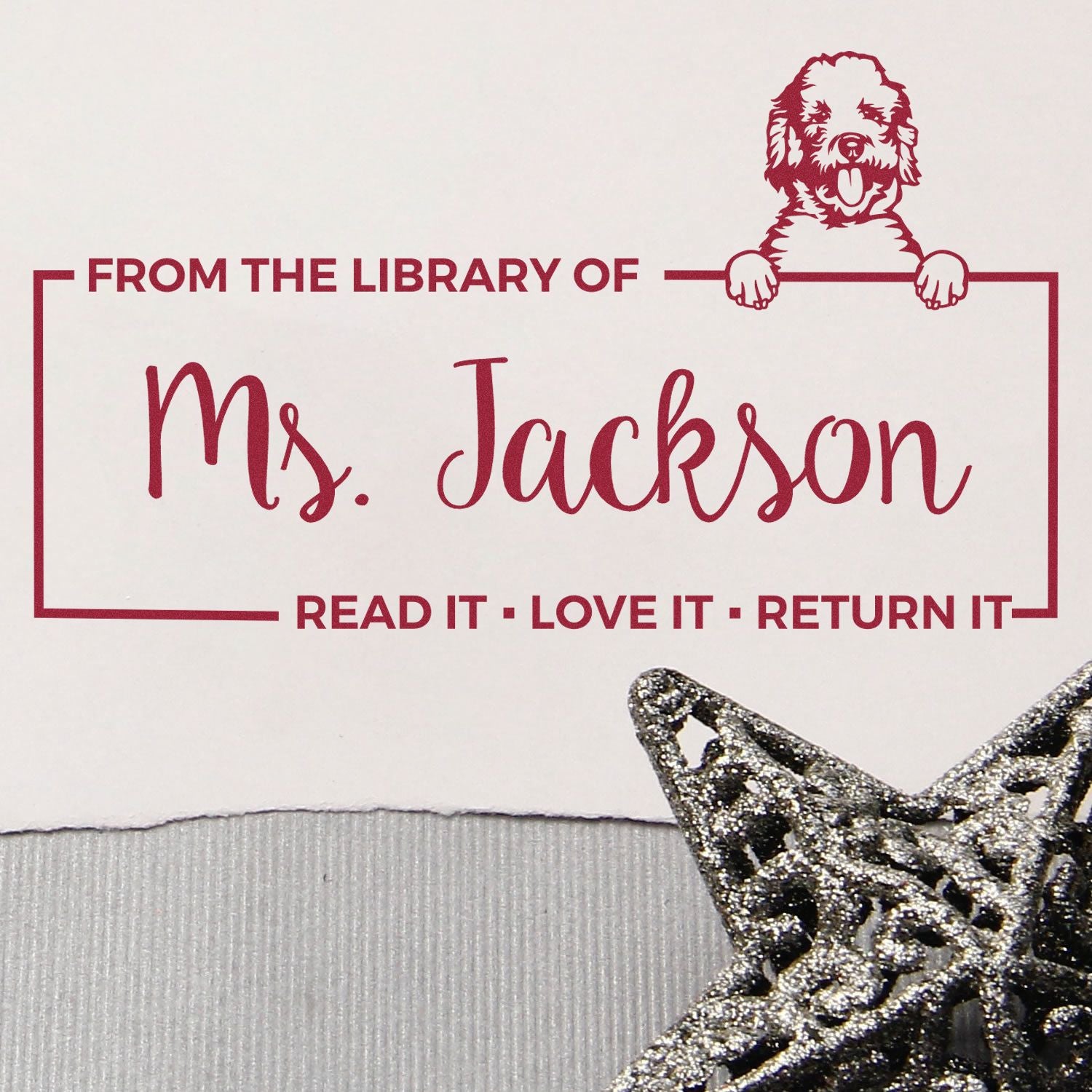 Custom rubber library book stamp for Ms. Jackson with dog design and Read it, love it, return it message.