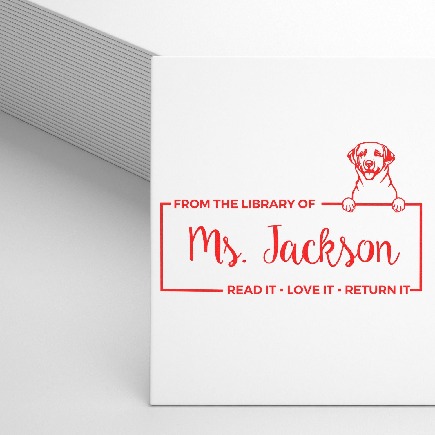 Custom dog-themed library rubber stamp for Ms. Jackson with Read it, Love it, Return it bookplate design.