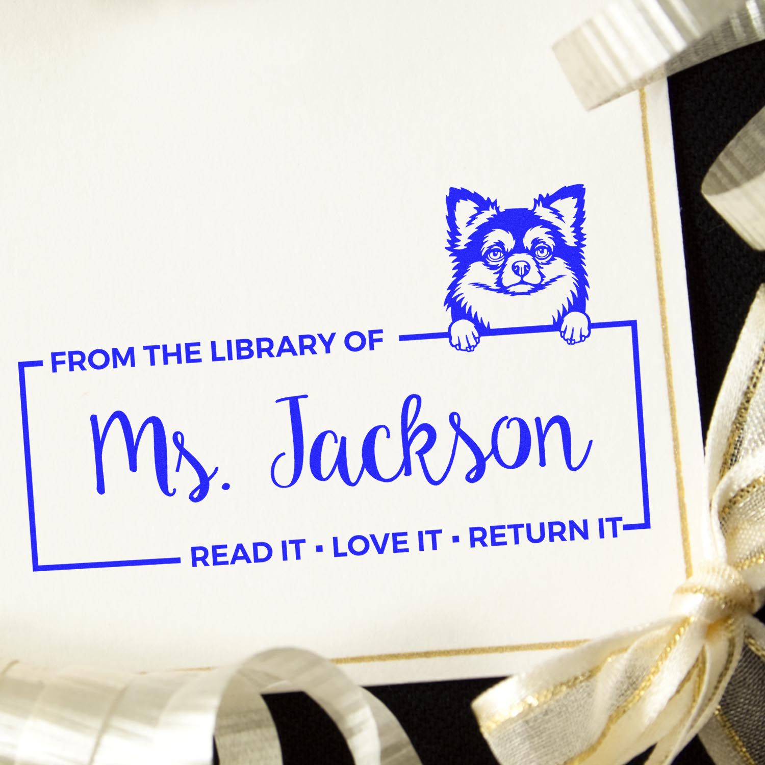 Custom library rubber stamp for Ms. Jackson, with dog icon and Read it  Love it  Return it bookplate message.