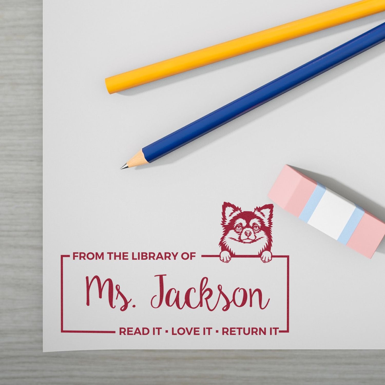 Custom library rubber stamp for Ms. Jackson with Read It, Love It, Return It and dog bookplate design.