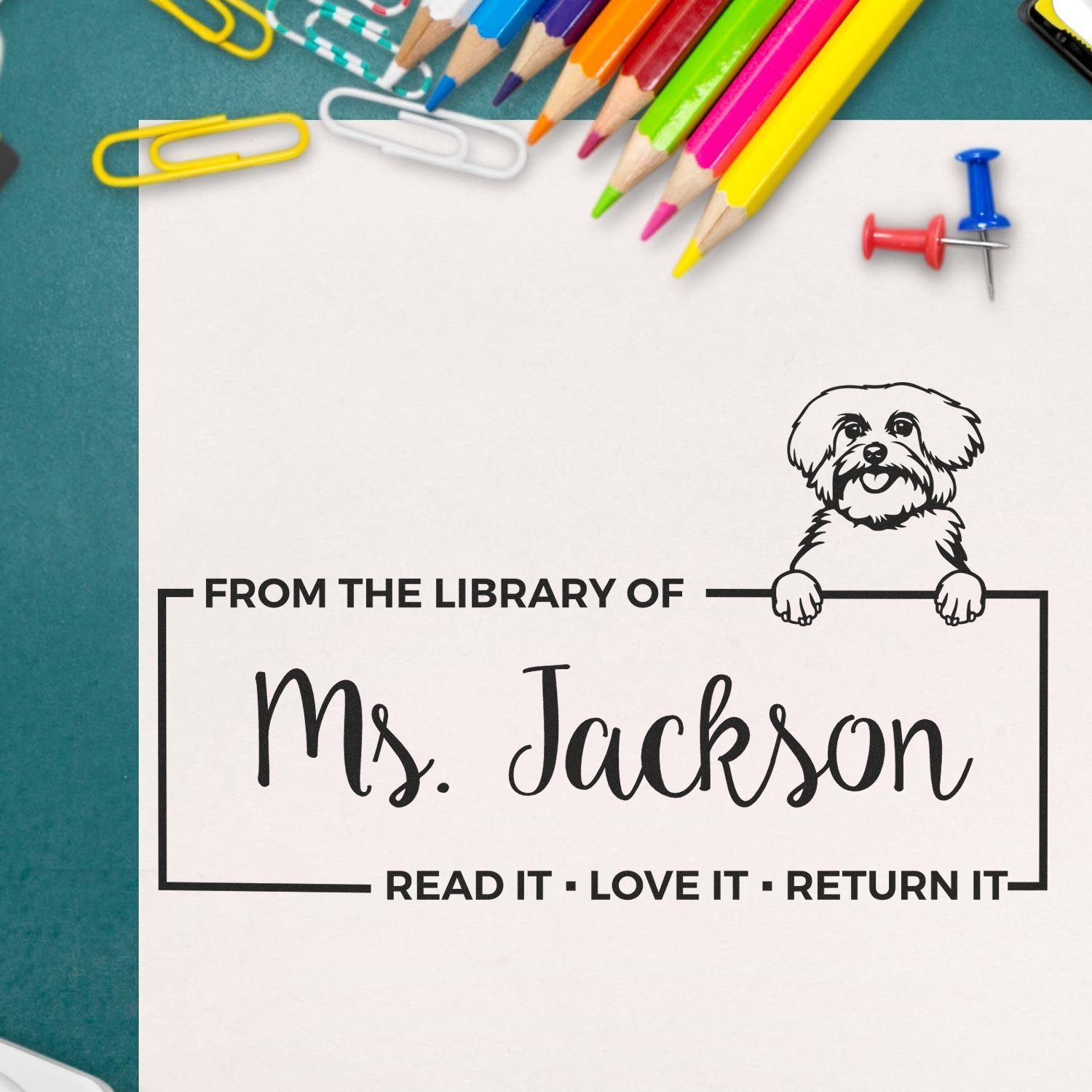 Custom library rubber stamp for Ms. Jackson with dog design and book return message, Read it, love it, return it.