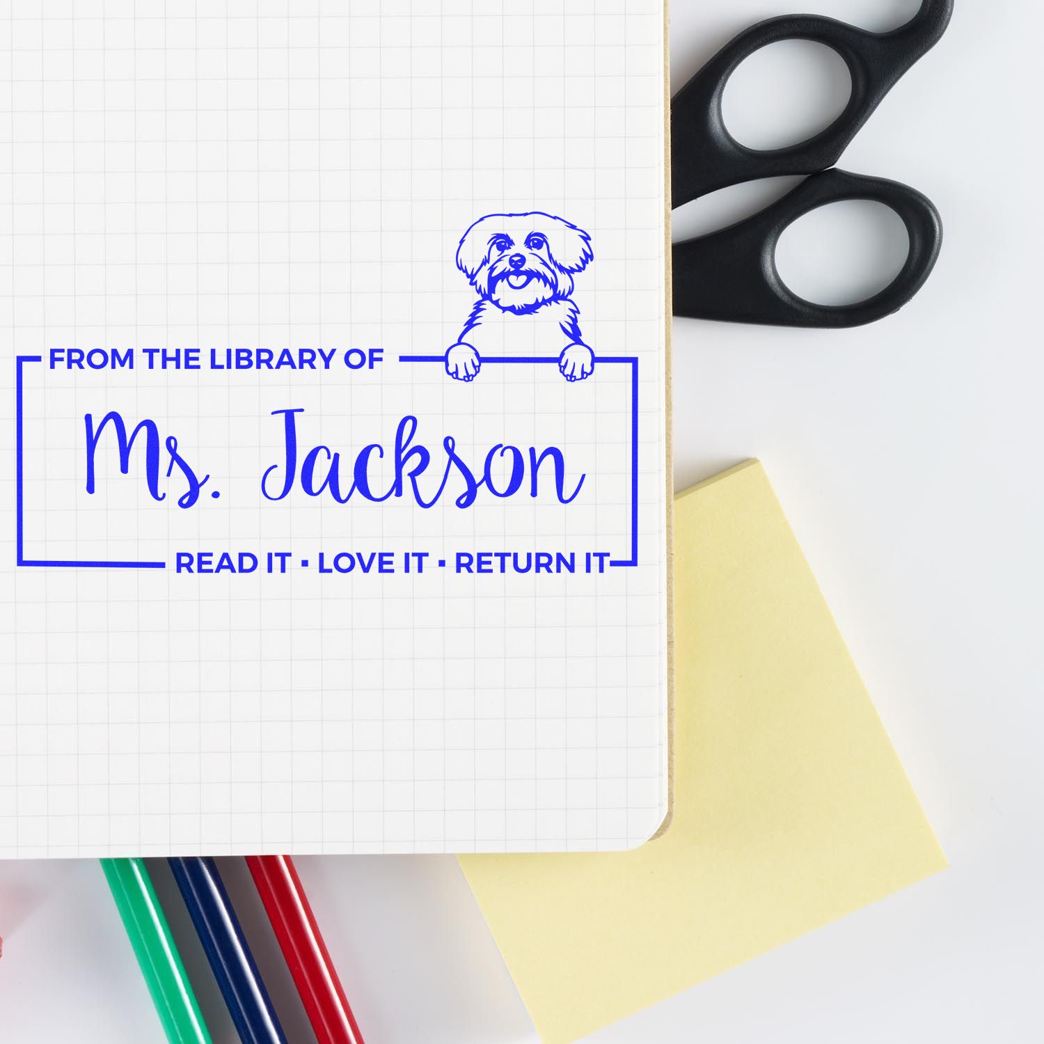 Personalized library book stamp for Ms. Jackson with dog icon and Read it, love it, return it message.