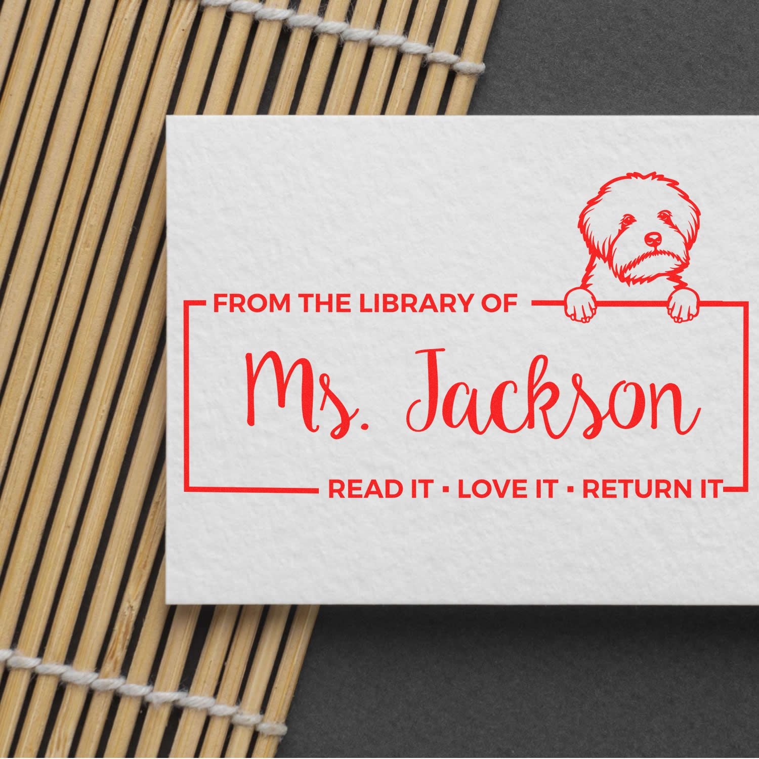 Custom rubber library stamp for Ms. Jackson with dog illustration and Read it, Love it, Return it message.