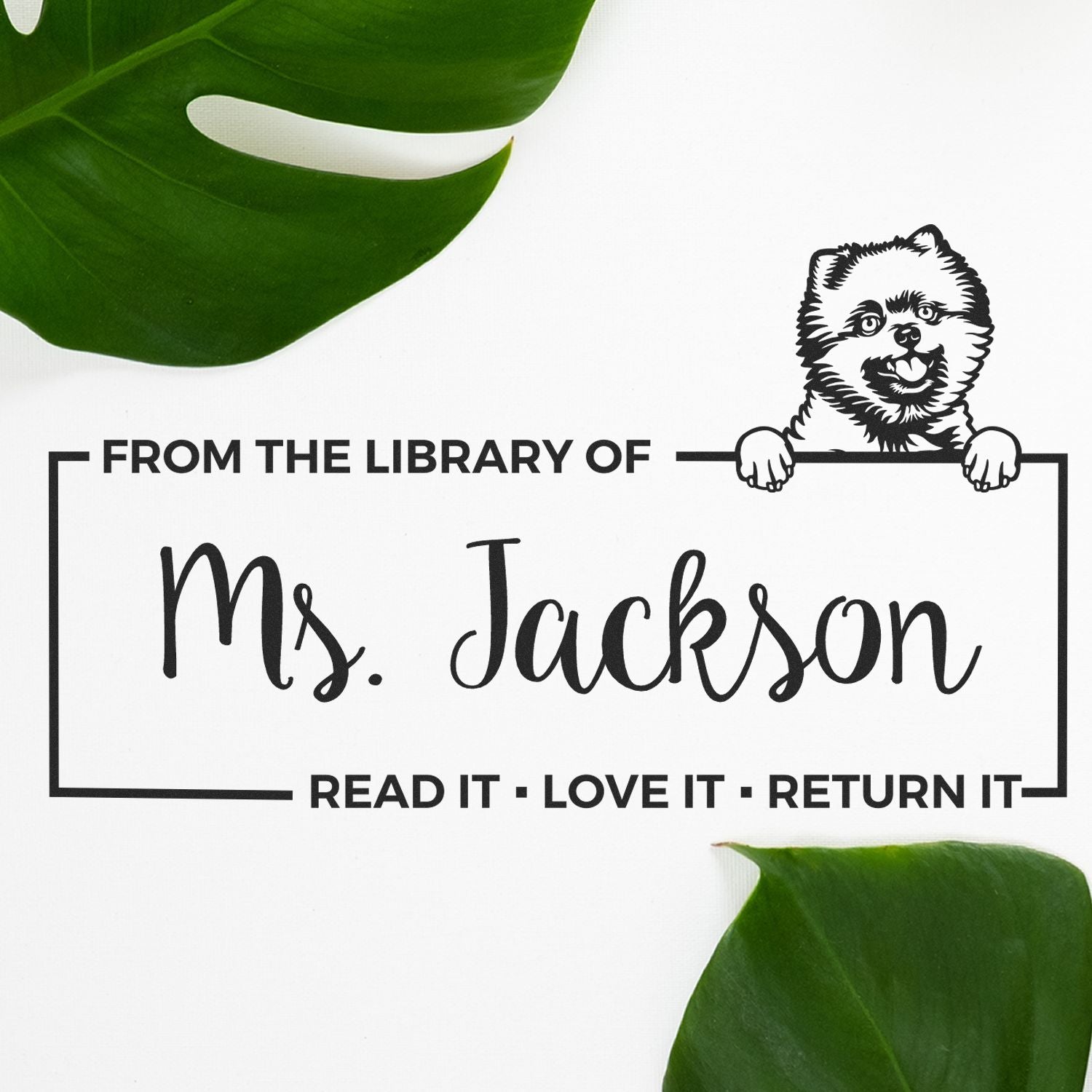 Personalized library rubber stamp with dog illustration and From the Library of Ms. Jackson return book text