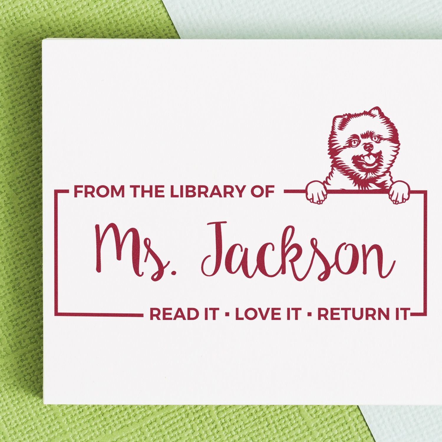 Custom library rubber stamp with dog illustration for Ms. Jackson, featuring Read It - Love It - Return It bookplate text.