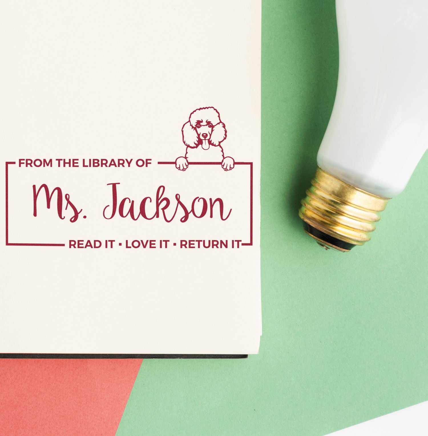 Personalized library rubber stamp for books, featuring Ms. Jackson, a dog design, and the phrase Read it, Love it, Return it.