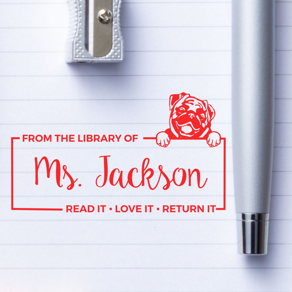 Personalized library book stamp for Ms. Jackson with bulldog design and Read it, love it, return it message.