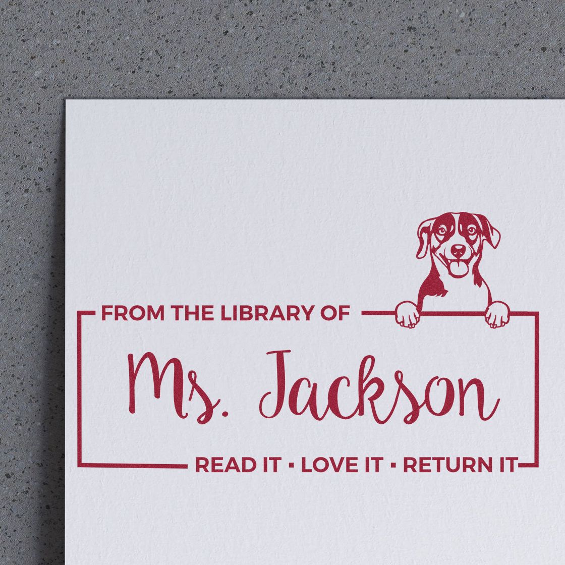 Custom library return rubber stamp with dog illustration and From the library of Ms. Jackson text.