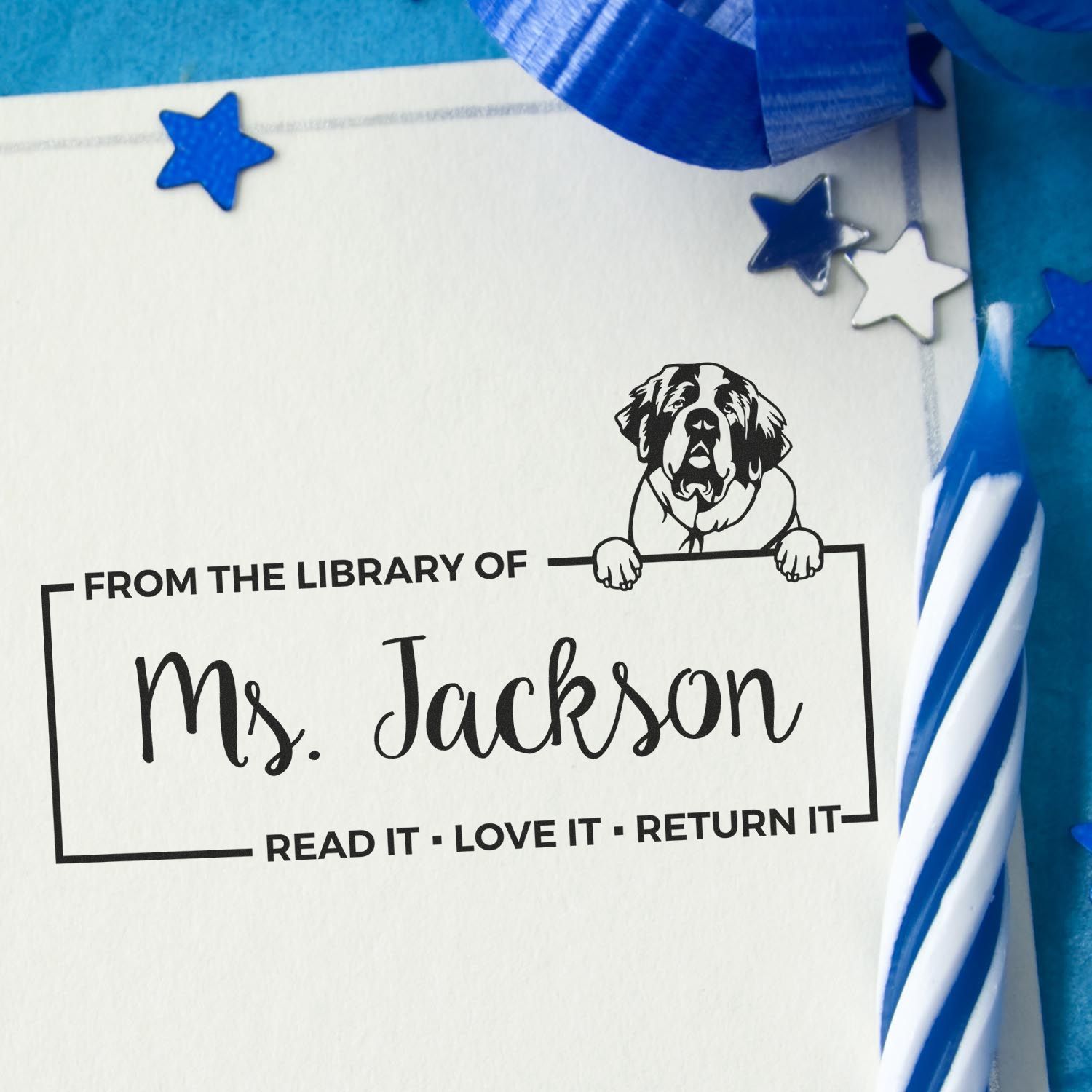 Personalized library rubber stamp for Ms. Jackson with dog design and Read it, love it, return it book ownership message.