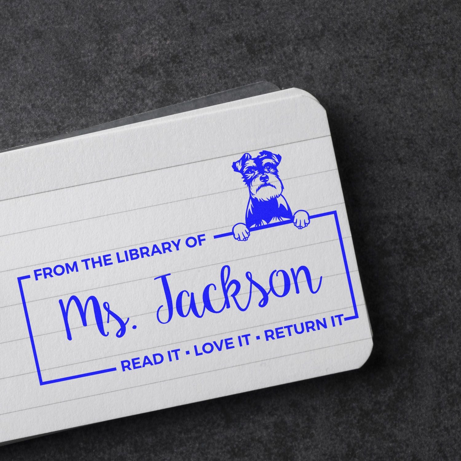 Personalized library rubber stamp for Ms. Jackson with dog design and Read it, love it, return it bookplate text