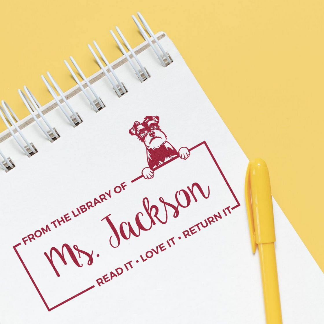 Custom rubber stamp for library books, reading From the Library of Ms. Jackson with dog illustration and return reminder.