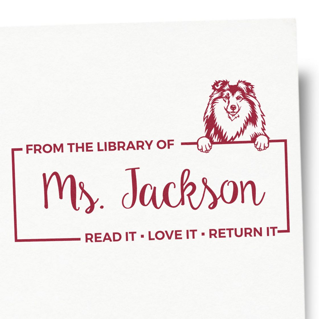Personalized library rubber stamp for Ms. Jackson with dog design and Read it, love it, return it bookplate text.