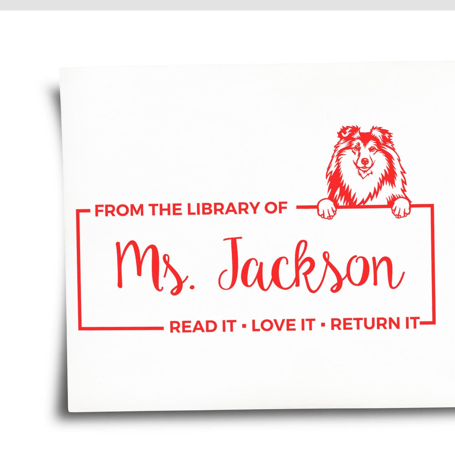 Custom rubber library book stamp for Ms. Jackson with dog design and Read it, love it, return it message.