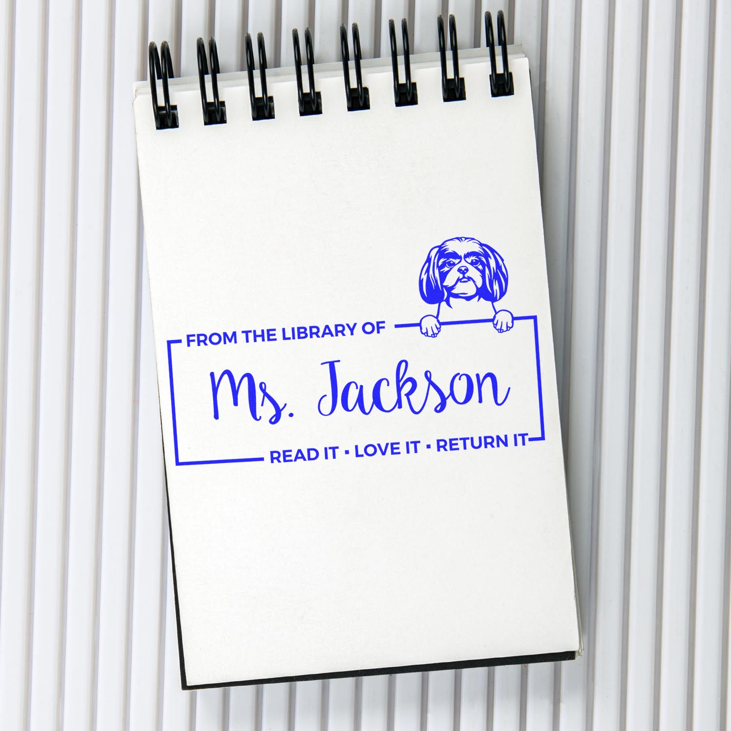 Personalized library rubber stamp for Ms. Jackson with dog bookplate and Read it, Love it, Return it text.