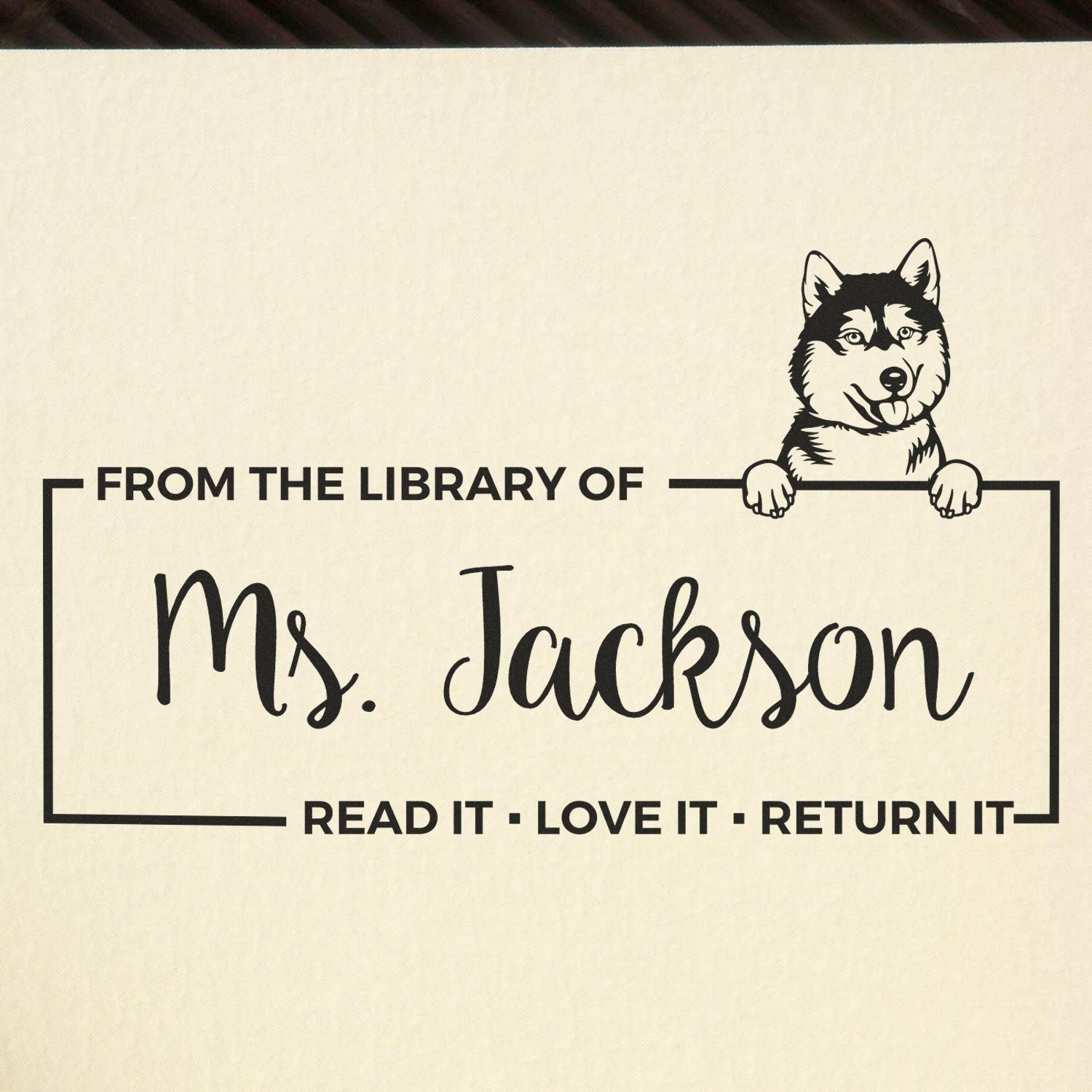 Custom rubber library stamp with husky dog, labeled From the library of Ms. Jackson and Read it, love it, return it
