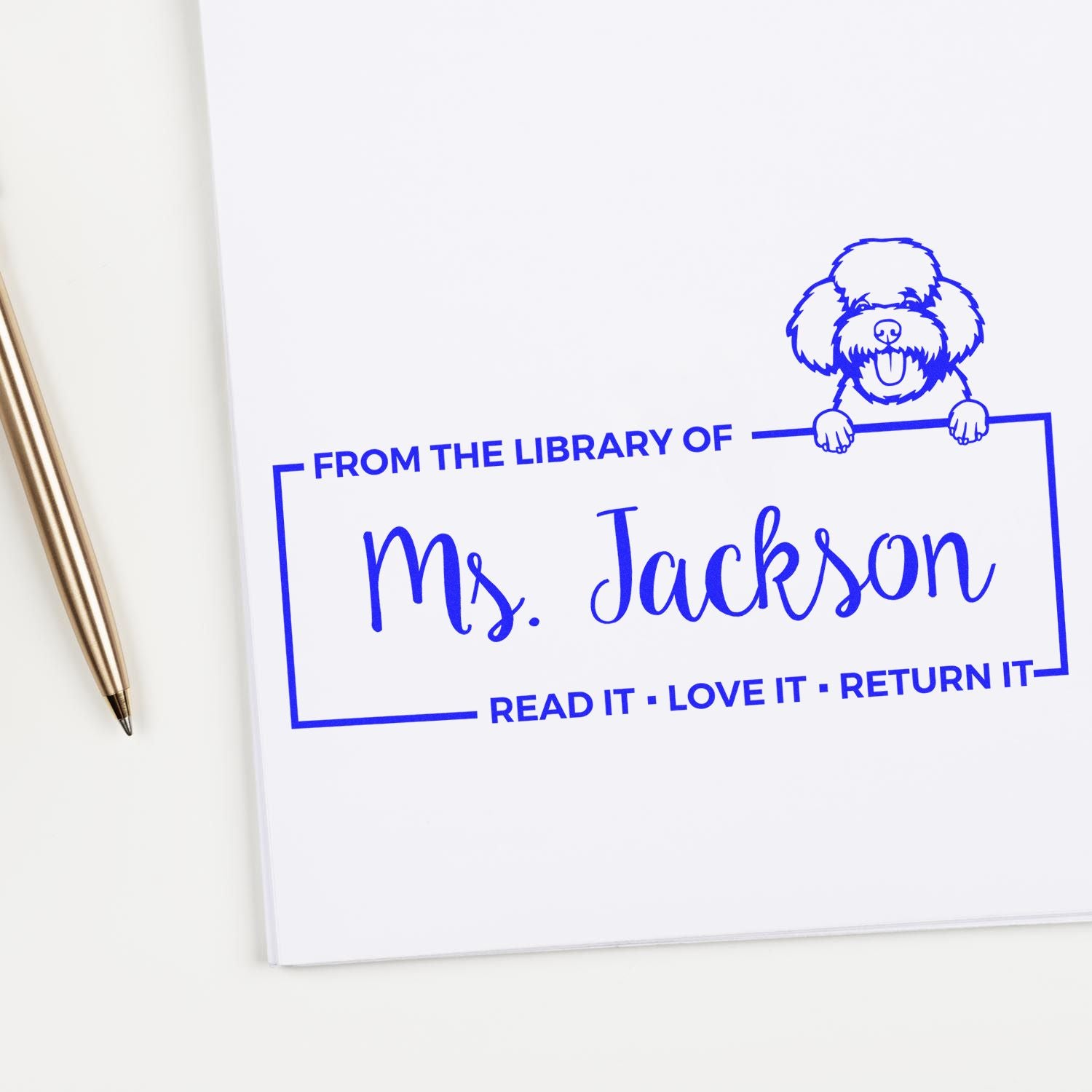 Custom library rubber stamp with dog graphic and Ms. Jackson name, perfect for personalizing books and book returns.