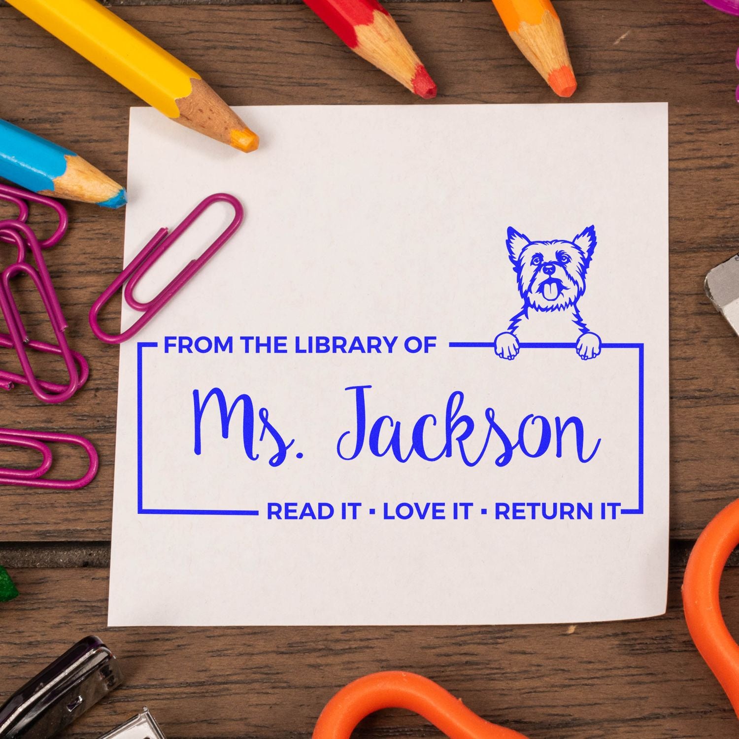 Custom library book stamp for Ms. Jackson with dog mascot and Read It, Love It, Return It bookplate design.
