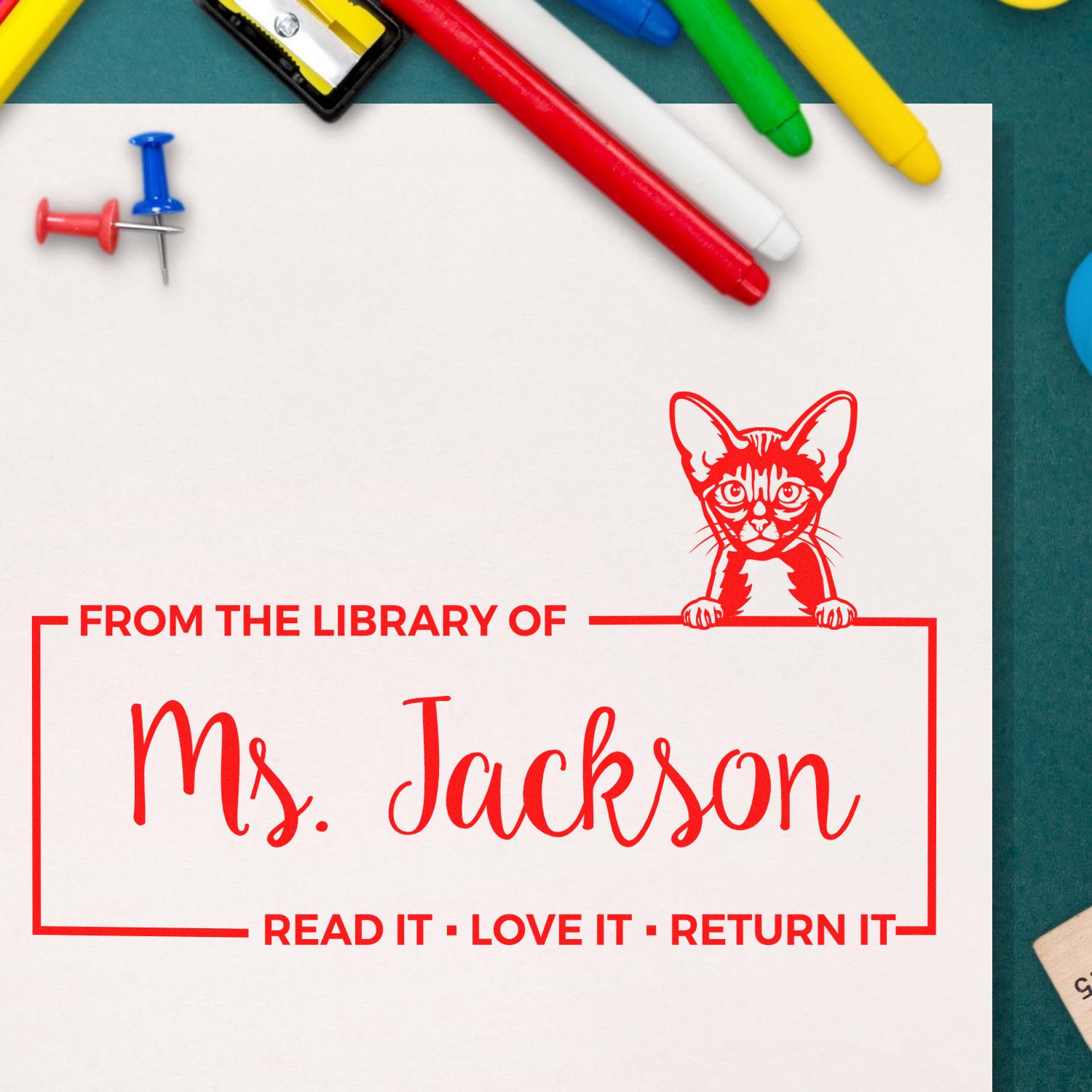 Personalized cat library rubber stamp for Ms. Jackson with Read it, love it, return it bookplate design.