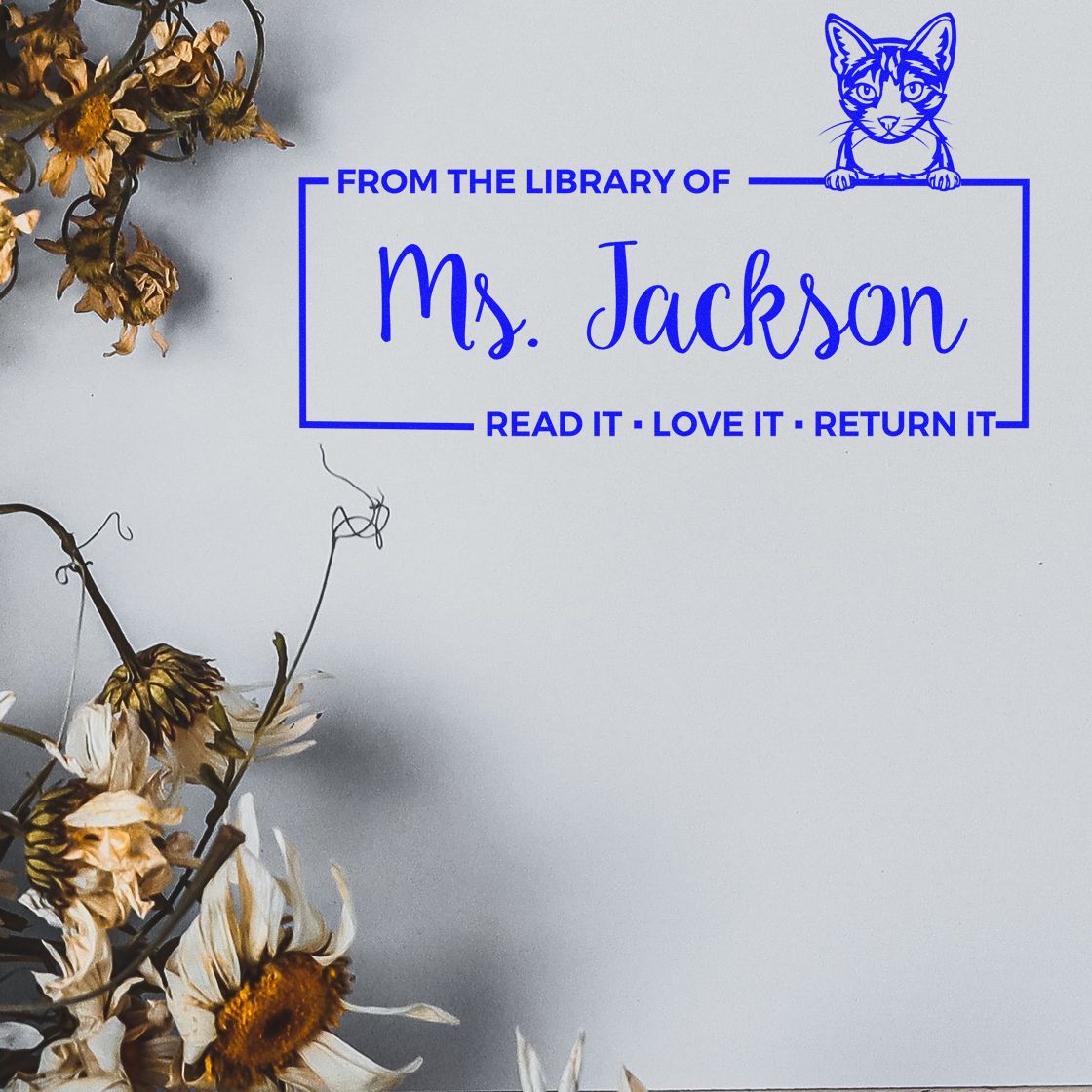 Custom library rubber stamp for Ms. Jackson with cat icon and Read it, love it, return it book plate text.