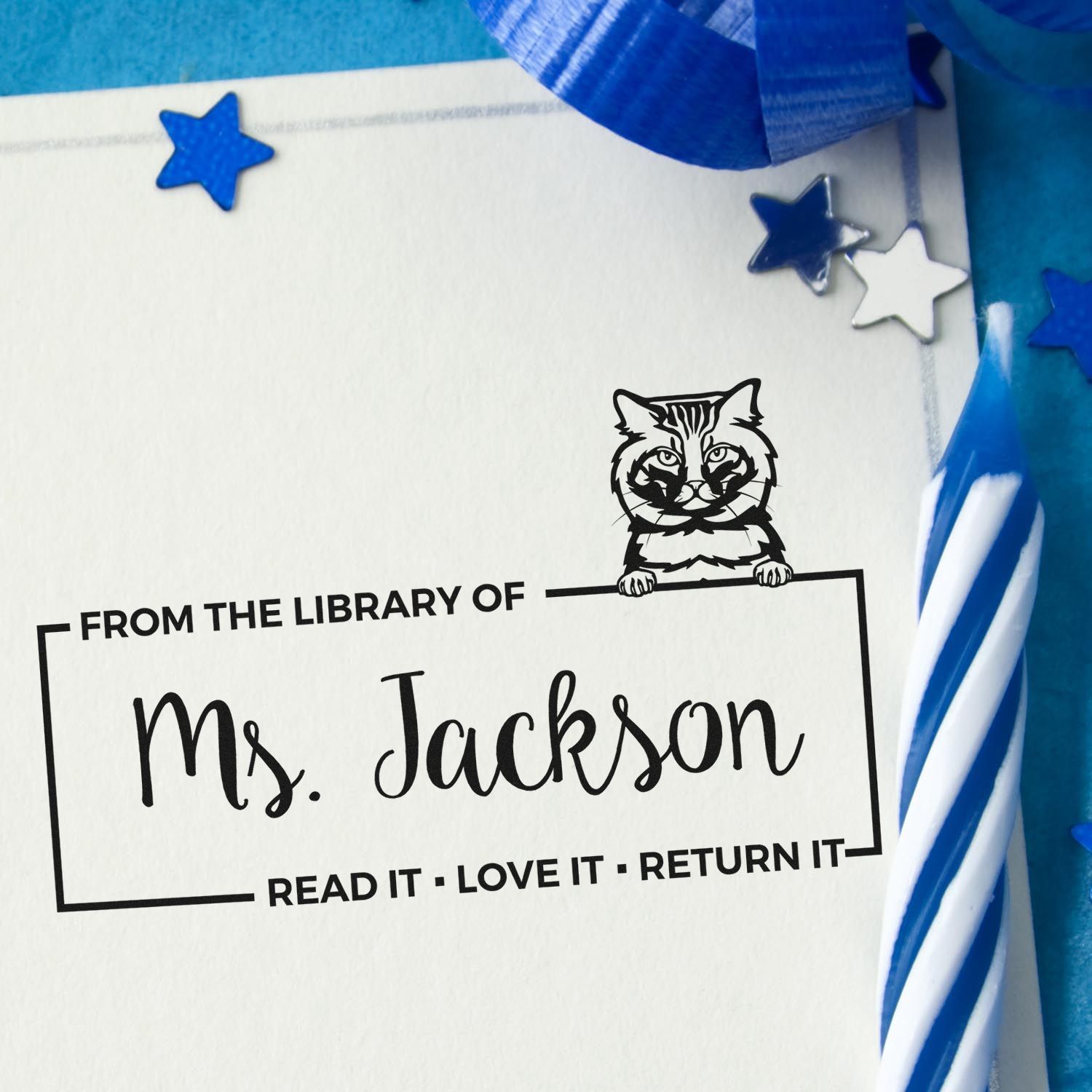 Custom library rubber stamp for Ms. Jackson with cat design and Read it, love it, return it message.