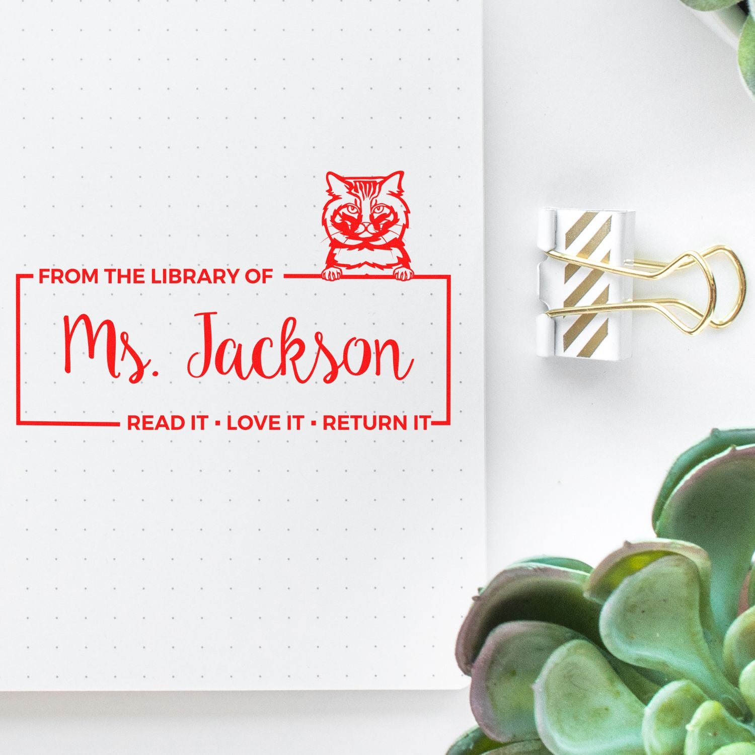 Custom library rubber stamp for Ms. Jackson with cat design and Read it, Love it, Return it bookplate message.