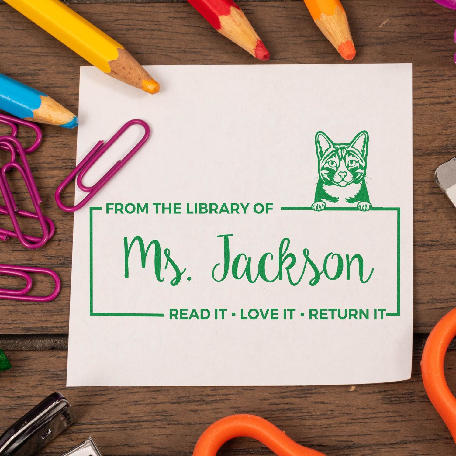 Personalized cat library rubber stamp for Ms. Jackson with Read It, Love It, Return It bookplate design