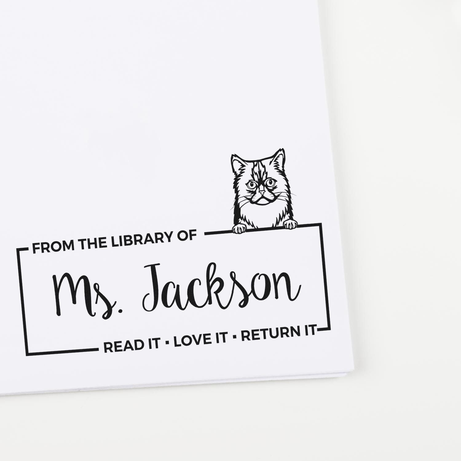 Personalized cat library rubber stamp for Ms. Jackson with Read it, Love it, Return it bookplate design.
