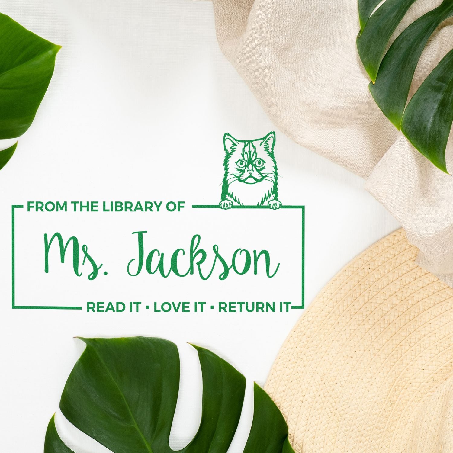 Custom rubber stamp for Ms. Jackson library books, featuring a cat illustration and Read it, love it, return it message.