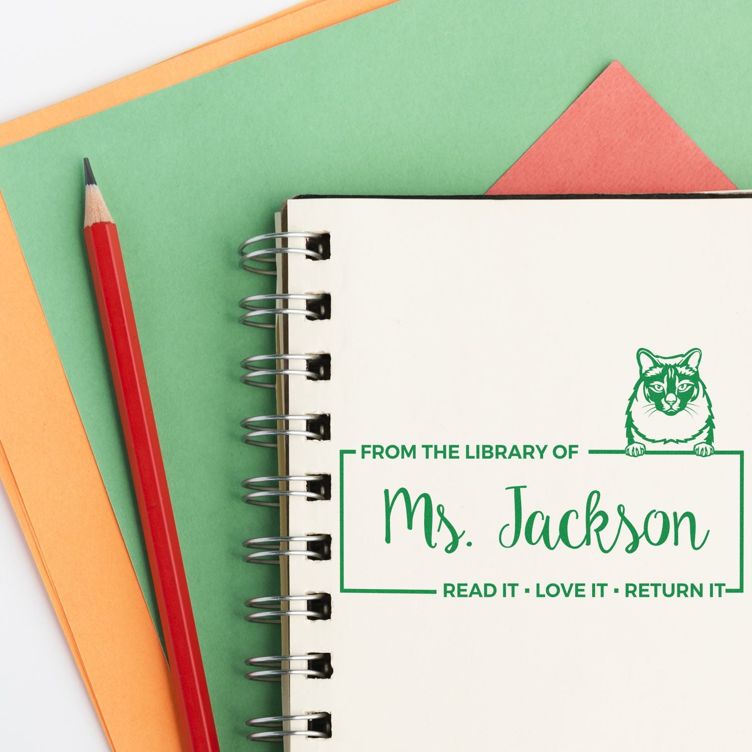Custom rubber stamp reading From the Library of Ms. Jackson with cat icon, perfect for personalized book and library stamps.