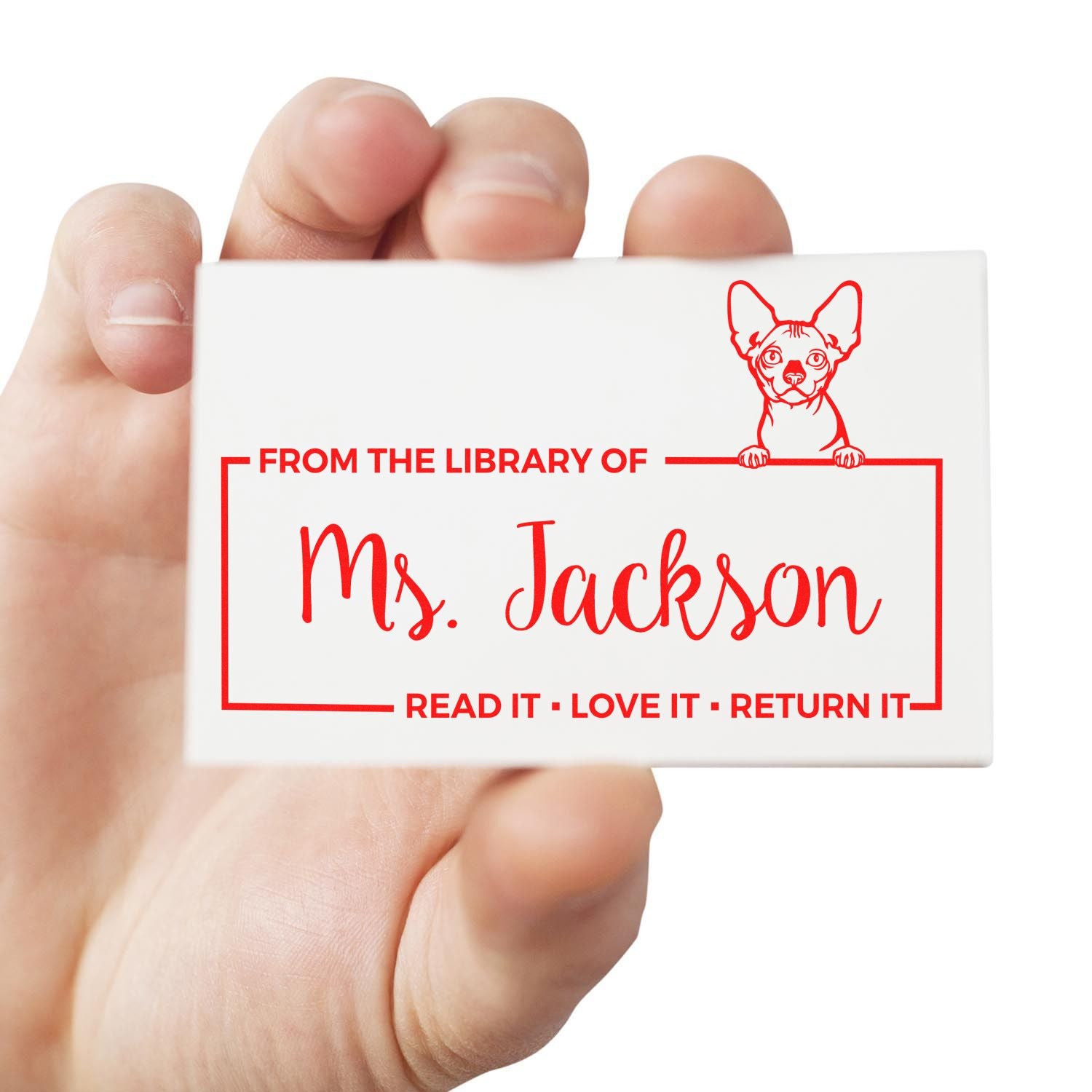 Custom library rubber stamp for Ms. Jackson, featuring a dog and Read it, love it, return it bookplate design.